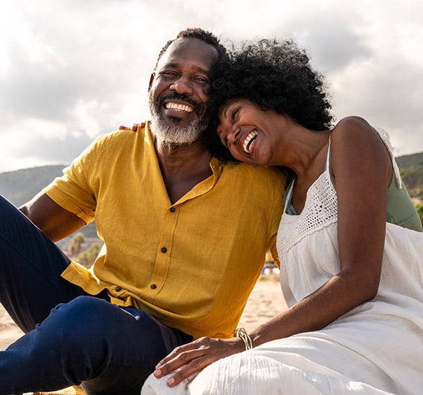 Beautiful mature black couple of lovers dating at the seaside